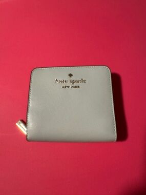 kate spade Light Gray Saffiano Zip Around Compact Wallet with Gold Logo